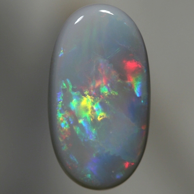 SOLID SEMI BLACK OPAL Bright reds to peacock fire with gold